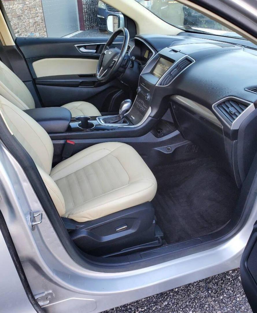 2015 Silver Ford Edge (2FMTK4J90FB) with an 2.0L I4 Turbocharger 2.0L I4 engine, located at 4845 Woodbury Pike, Roaring Springs, PA, (814) 317-5008, (814) 317-5008, 40.250935, -78.366959 - 2015 Ford Edge SEL AWD 4 dr Crossover 2.0L I4 Turbocharger 171k miles Fully serviced and ready to go! New brakes and rotors all around. Leather, Sirius XM, Single CD Player, Bluetooth, Back-up Camera, Heated Seats, Heated Side Mirrors, Moon Roof. Selling so cheap because it has an R-Title due to a h - Photo#13