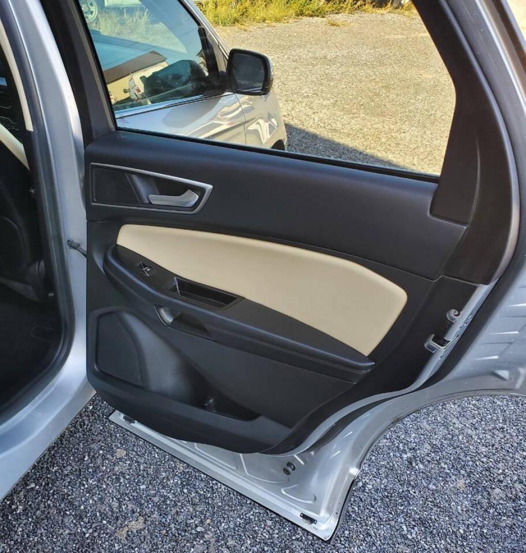 2015 Silver Ford Edge (2FMTK4J90FB) with an 2.0L I4 Turbocharger 2.0L I4 engine, located at 4845 Woodbury Pike, Roaring Springs, PA, (814) 317-5008, (814) 317-5008, 40.250935, -78.366959 - 2015 Ford Edge SEL AWD 4 dr Crossover 2.0L I4 Turbocharger 171k miles Fully serviced and ready to go! New brakes and rotors all around. Leather, Sirius XM, Single CD Player, Bluetooth, Back-up Camera, Heated Seats, Heated Side Mirrors, Moon Roof. Selling so cheap because it has an R-Title due to a h - Photo#16