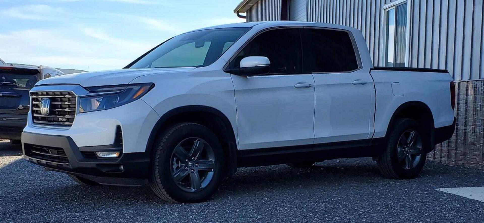 2023 White Honda Ridgeline (5FPYK3F50PB) with an 3.5L V6 3.5L V6 engine, located at 4845 Woodbury Pike, Roaring Springs, PA, (814) 317-5008, (814) 317-5008, 40.250935, -78.366959 - 2023 Honda Ridgeline RTL AWD Crew Cab 3.5L V6 9-speed Automatic 7,547 miles Fully Loaded!! Leather, Remote Start, Universal Remote Transmitter - Homelink - Garage Door Opener, Trailer Hitch, Backup Camera, Apple Carplay, Android Auto, Bluetooth, Sirius XM, Subwoofer, Sunroof, Lane Keeping Assist, He - Photo#4