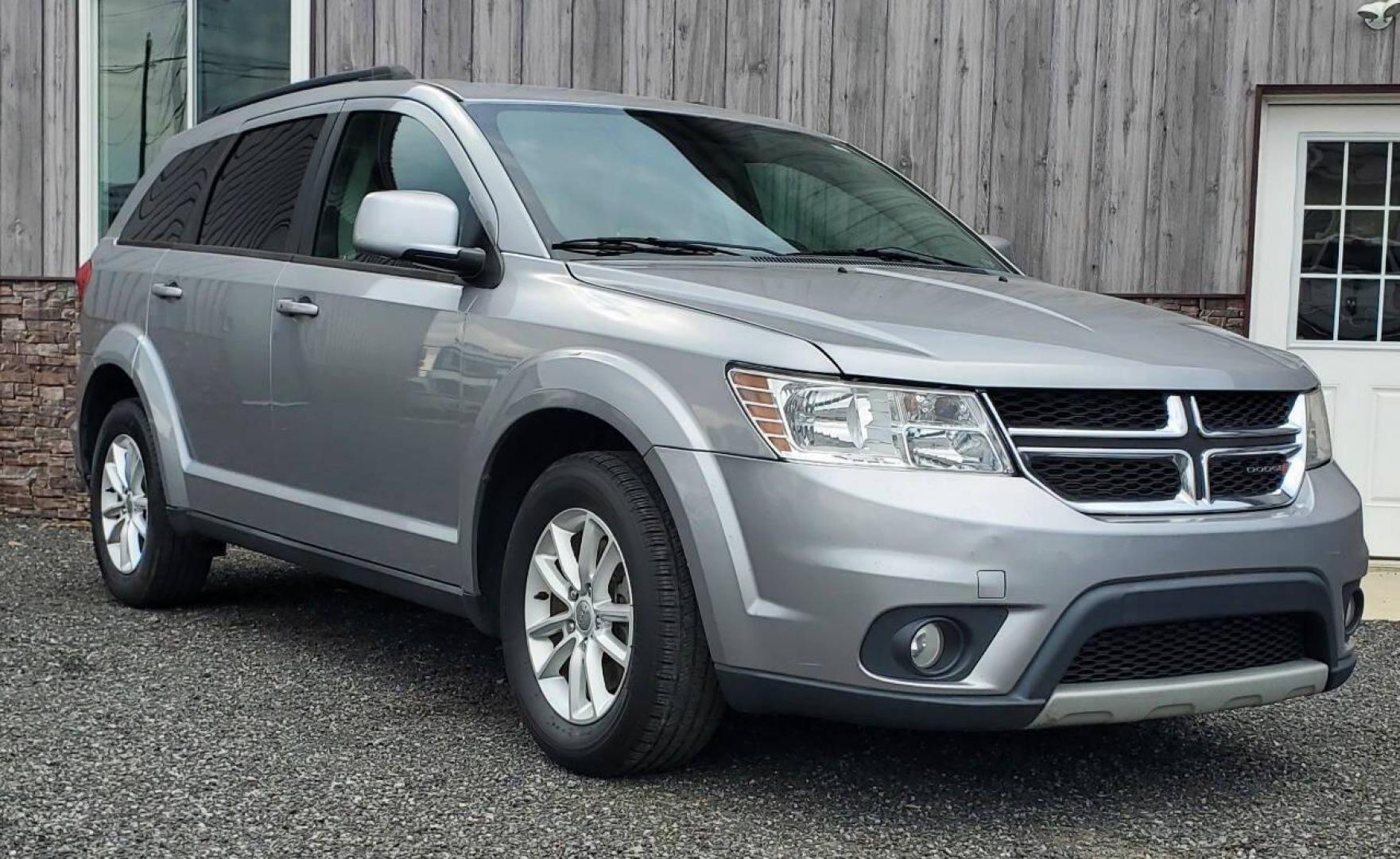 2015 Silver Dodge Journey (3C4PDCBG1FT) with an 3.6L V6 3.6L V6 engine, located at 4845 Woodbury Pike, Roaring Springs, PA, (814) 317-5008, (814) 317-5008, 40.250935, -78.366959 - 2015 Dodge Journey SXT FWD 3.6L V6 Automatic 155k miles 3rd Row Seating, CD Player, SiriusXM, Power Windows, Locks and Mirrors, A/C. Very clean vehicle! Selling cheaply because it has an R-Title due to previous deer damage to the passenger fender. This vehicle will come with a 3 mo./3,000-mile warra - Photo#0