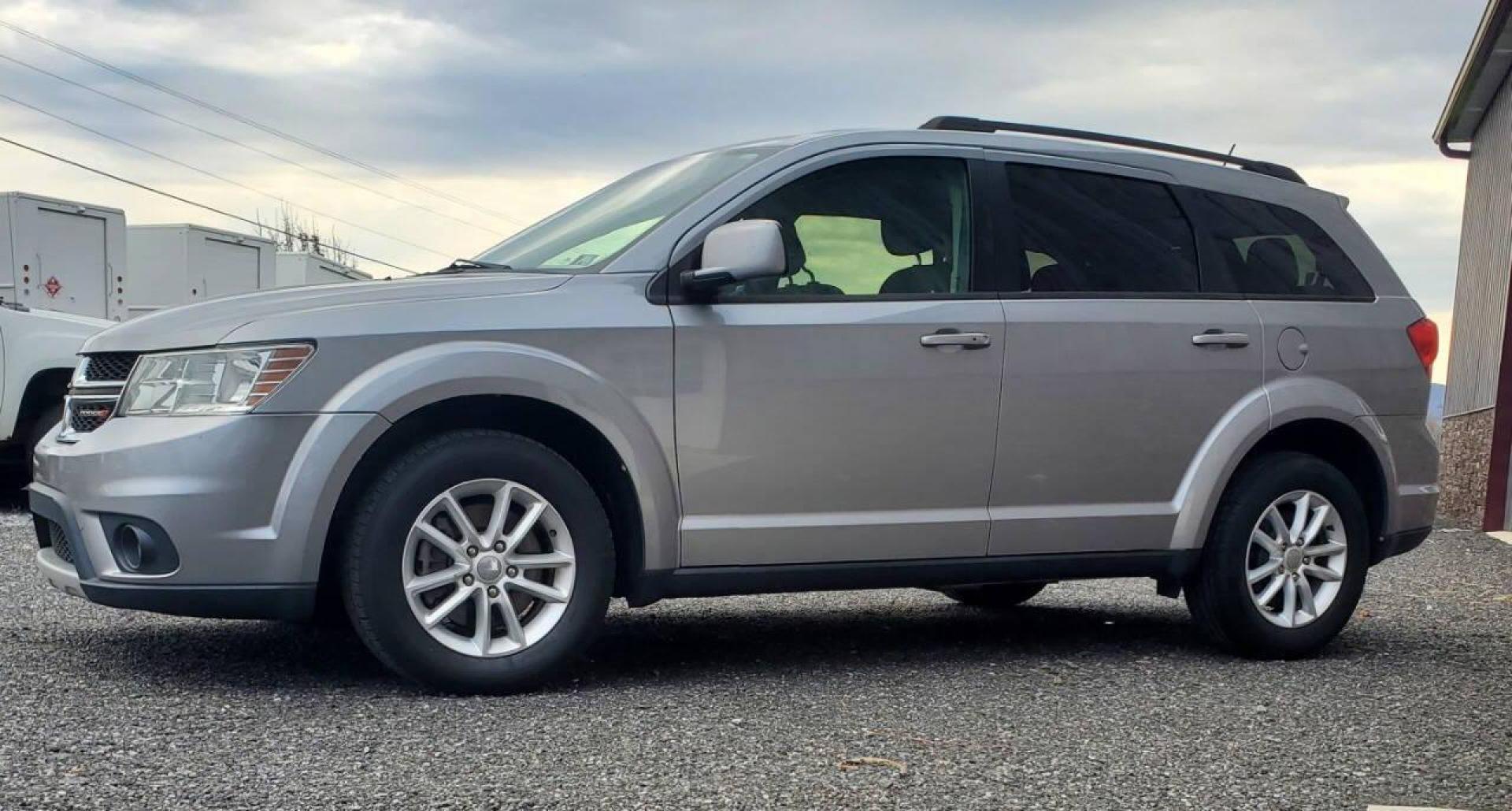 2015 Silver Dodge Journey (3C4PDCBG1FT) with an 3.6L V6 3.6L V6 engine, located at 4845 Woodbury Pike, Roaring Springs, PA, (814) 317-5008, (814) 317-5008, 40.250935, -78.366959 - 2015 Dodge Journey SXT FWD 3.6L V6 Automatic 155k miles 3rd Row Seating, CD Player, SiriusXM, Power Windows, Locks and Mirrors, A/C. Very clean vehicle! Selling cheaply because it has an R-Title due to previous deer damage to the passenger fender. This vehicle will come with a 3 mo./3,000-mile warra - Photo#4