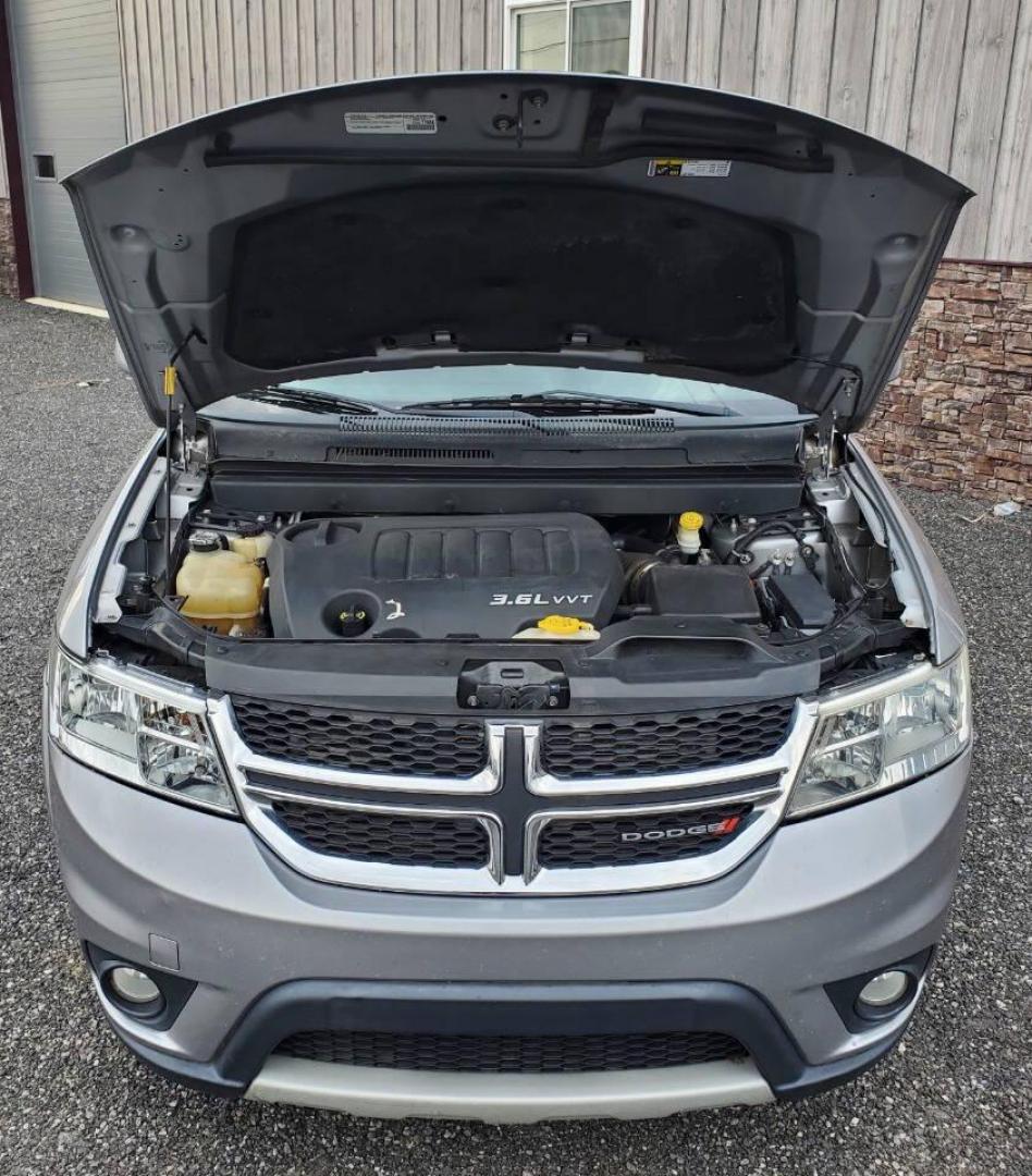 2015 Silver Dodge Journey (3C4PDCBG1FT) with an 3.6L V6 3.6L V6 engine, located at 4845 Woodbury Pike, Roaring Springs, PA, (814) 317-5008, (814) 317-5008, 40.250935, -78.366959 - 2015 Dodge Journey SXT FWD 3.6L V6 Automatic 155k miles 3rd Row Seating, CD Player, SiriusXM, Power Windows, Locks and Mirrors, A/C. Very clean vehicle! Selling cheaply because it has an R-Title due to previous deer damage to the passenger fender. This vehicle will come with a 3 mo./3,000-mile warra - Photo#5