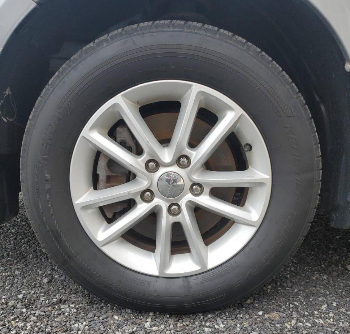 2015 Silver Dodge Journey (3C4PDCBG1FT) with an 3.6L V6 3.6L V6 engine, located at 4845 Woodbury Pike, Roaring Springs, PA, (814) 317-5008, (814) 317-5008, 40.250935, -78.366959 - 2015 Dodge Journey SXT FWD 3.6L V6 Automatic 155k miles 3rd Row Seating, CD Player, SiriusXM, Power Windows, Locks and Mirrors, A/C. Very clean vehicle! Selling cheaply because it has an R-Title due to previous deer damage to the passenger fender. This vehicle will come with a 3 mo./3,000-mile warra - Photo#6