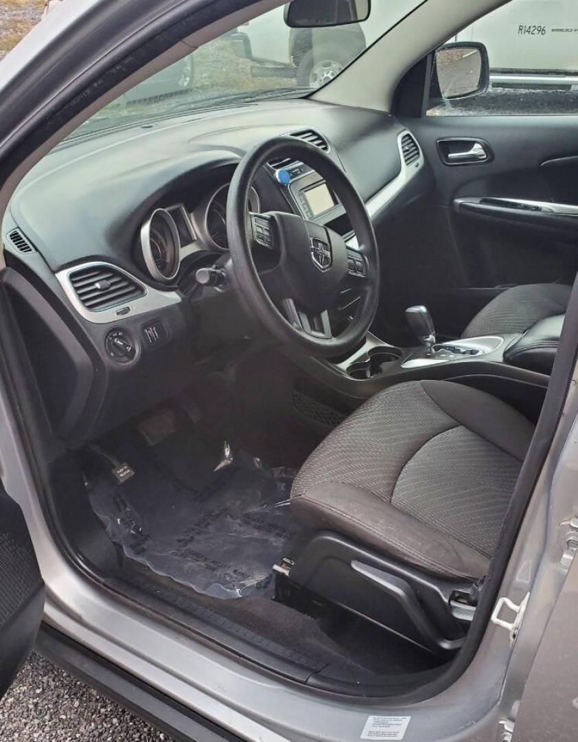 2015 Silver Dodge Journey (3C4PDCBG1FT) with an 3.6L V6 3.6L V6 engine, located at 4845 Woodbury Pike, Roaring Springs, PA, (814) 317-5008, (814) 317-5008, 40.250935, -78.366959 - 2015 Dodge Journey SXT FWD 3.6L V6 Automatic 155k miles 3rd Row Seating, CD Player, SiriusXM, Power Windows, Locks and Mirrors, A/C. Very clean vehicle! Selling cheaply because it has an R-Title due to previous deer damage to the passenger fender. This vehicle will come with a 3 mo./3,000-mile warra - Photo#8