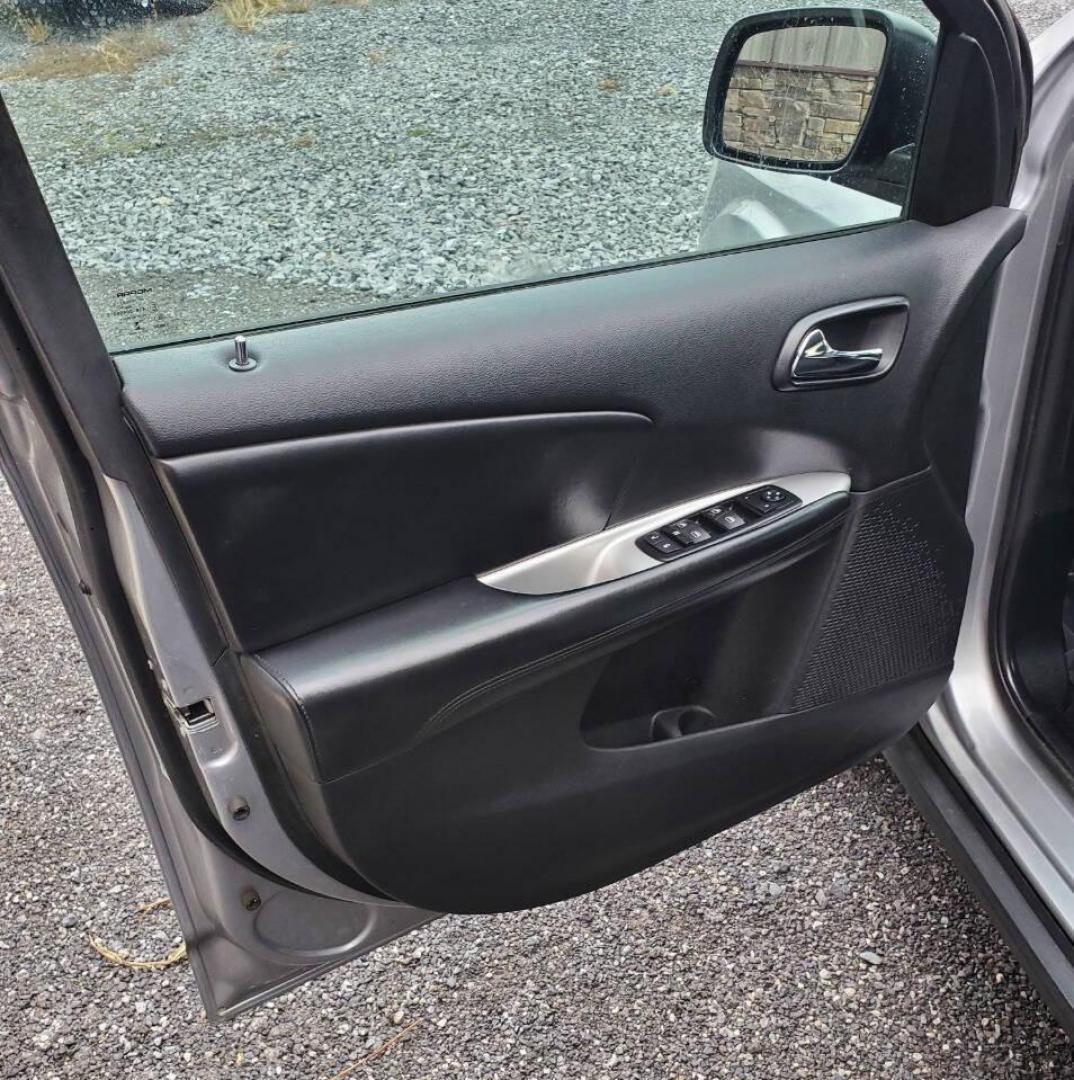 2015 Silver Dodge Journey (3C4PDCBG1FT) with an 3.6L V6 3.6L V6 engine, located at 4845 Woodbury Pike, Roaring Springs, PA, (814) 317-5008, (814) 317-5008, 40.250935, -78.366959 - 2015 Dodge Journey SXT FWD 3.6L V6 Automatic 155k miles 3rd Row Seating, CD Player, SiriusXM, Power Windows, Locks and Mirrors, A/C. Very clean vehicle! Selling cheaply because it has an R-Title due to previous deer damage to the passenger fender. This vehicle will come with a 3 mo./3,000-mile warra - Photo#9