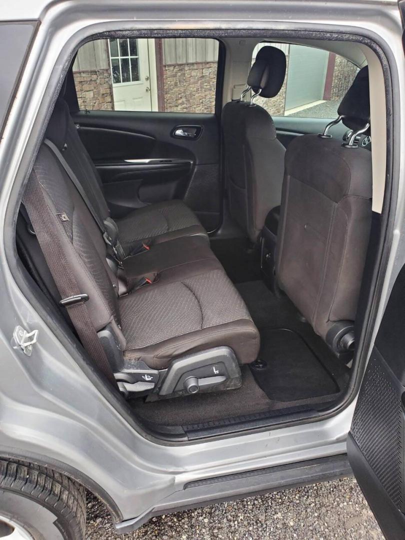 2015 Silver Dodge Journey (3C4PDCBG1FT) with an 3.6L V6 3.6L V6 engine, located at 4845 Woodbury Pike, Roaring Springs, PA, (814) 317-5008, (814) 317-5008, 40.250935, -78.366959 - 2015 Dodge Journey SXT FWD 3.6L V6 Automatic 155k miles 3rd Row Seating, CD Player, SiriusXM, Power Windows, Locks and Mirrors, A/C. Very clean vehicle! Selling cheaply because it has an R-Title due to previous deer damage to the passenger fender. This vehicle will come with a 3 mo./3,000-mile warra - Photo#14