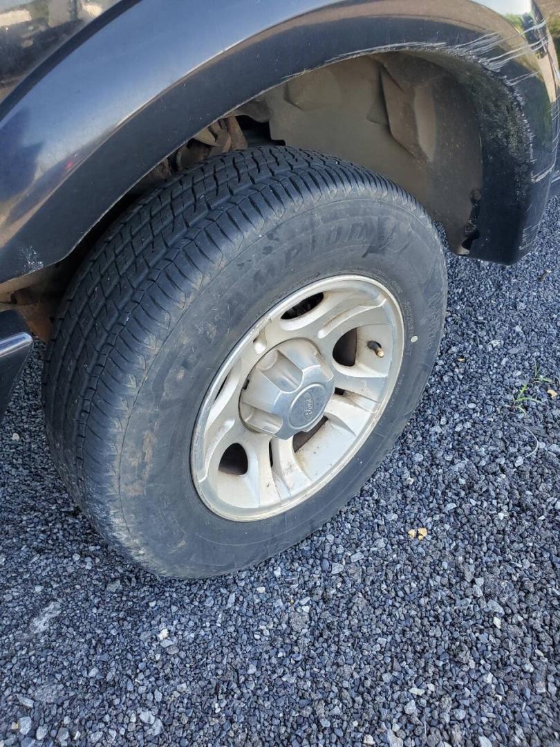 2003 Black Ford Ranger (1FTYR10UX3T) with an 3.0L V6 3.0L V6 engine, located at 4845 Woodbury Pike, Roaring Springs, PA, (814) 317-5008, (814) 317-5008, 40.250935, -78.366959 - 2003 Ford Ranger Edge 3.0L V6 Automatic 226K miles RWD Clean Title, being sold As Is. Southern truck that runs and drives great! No mechanical issues. It was driven over 200 miles home from the auction with no issues. It will need inspected for PA because it is from Virginia. If you have any questi- Photo#2