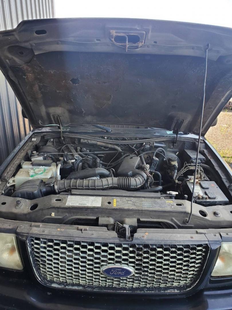 2003 Black Ford Ranger (1FTYR10UX3T) with an 3.0L V6 3.0L V6 engine, located at 4845 Woodbury Pike, Roaring Springs, PA, (814) 317-5008, (814) 317-5008, 40.250935, -78.366959 - 2003 Ford Ranger Edge 3.0L V6 Automatic 226K miles RWD Clean Title, being sold As Is. Southern truck that runs and drives great! No mechanical issues. It was driven over 200 miles home from the auction with no issues. It will need inspected for PA because it is from Virginia. If you have any questi- Photo#3