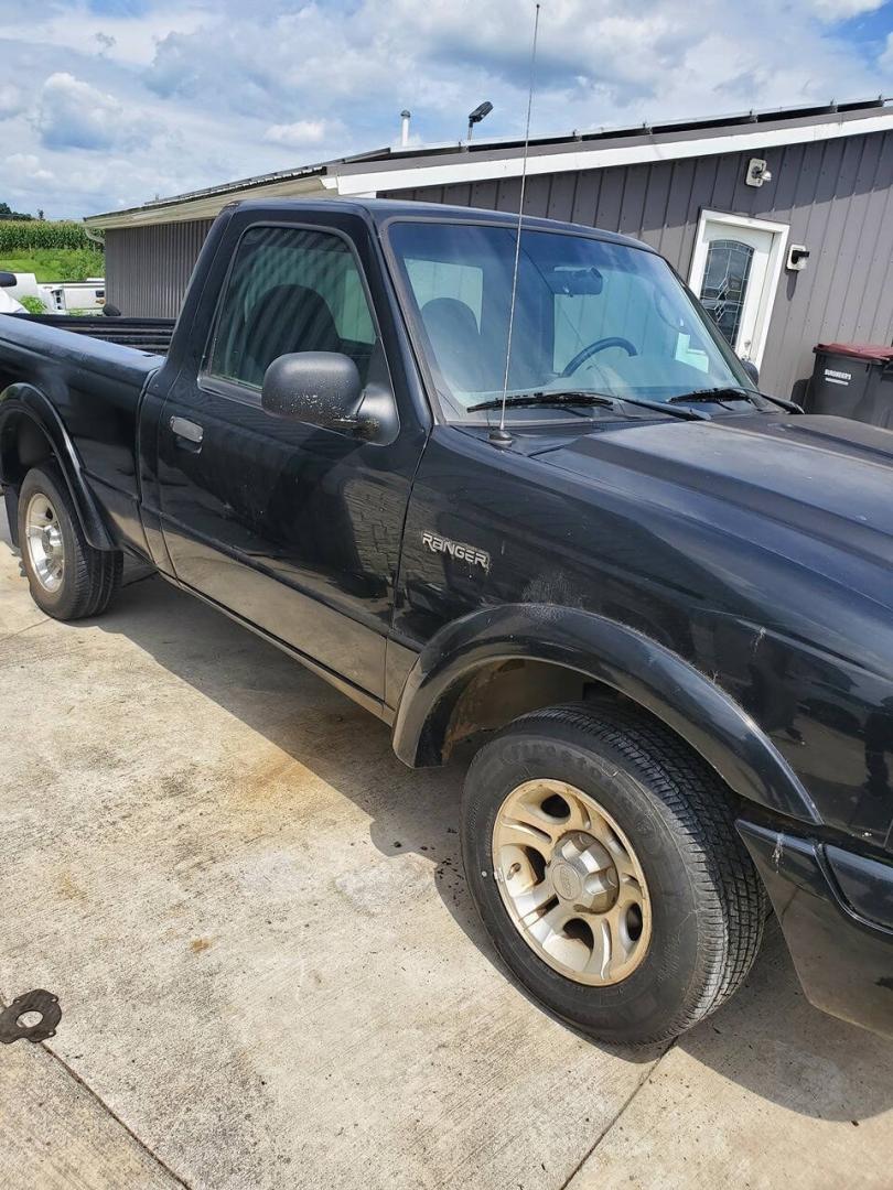 2003 Black Ford Ranger (1FTYR10UX3T) with an 3.0L Flex Fuel V6 154hp 180ft. lbs. 3.0L V6 engine, located at 4845 Woodbury Pike, Roaring Springs, PA, (814) 317-5008, (814) 317-5008, 40.250935, -78.366959 - 2003 Ford Ranger Edge 3.0L V6 Automatic 226K miles RWD Aftermarket Kenwood single CD player. Clean Title, being sold As Is. Southern truck that runs and drives great! No mechanical issues. It was driven over 200 miles home from the auction with no issues. It will need inspected for PA because it is- Photo#1