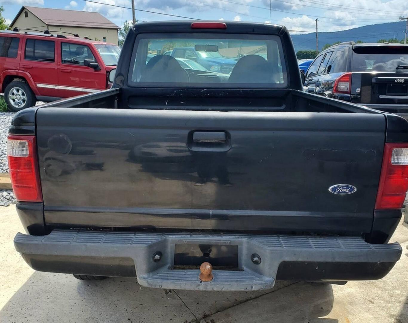 2003 Black Ford Ranger (1FTYR10UX3T) with an 3.0L Flex Fuel V6 154hp 180ft. lbs. 3.0L V6 engine, located at 4845 Woodbury Pike, Roaring Springs, PA, (814) 317-5008, (814) 317-5008, 40.250935, -78.366959 - 2003 Ford Ranger Edge 3.0L V6 Automatic 226K miles RWD Aftermarket Kenwood single CD player. Clean Title, being sold As Is. Southern truck that runs and drives great! No mechanical issues. It was driven over 200 miles home from the auction with no issues. It will need inspected for PA because it is- Photo#2