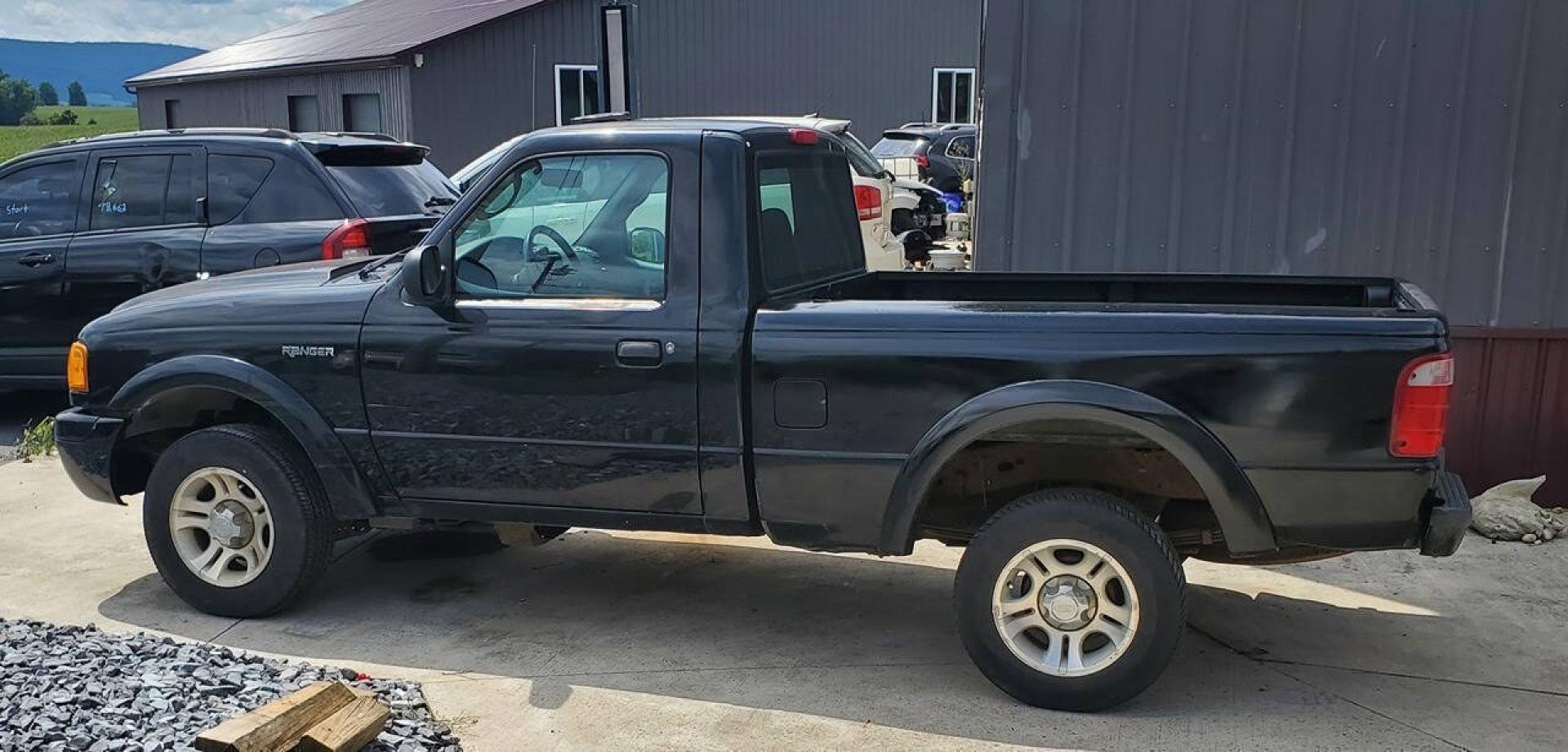 2003 Black Ford Ranger (1FTYR10UX3T) with an 3.0L Flex Fuel V6 154hp 180ft. lbs. 3.0L V6 engine, located at 4845 Woodbury Pike, Roaring Springs, PA, (814) 317-5008, (814) 317-5008, 40.250935, -78.366959 - 2003 Ford Ranger Edge 3.0L V6 Automatic 226K miles RWD Aftermarket Kenwood single CD player. Clean Title, being sold As Is. Southern truck that runs and drives great! No mechanical issues. It was driven over 200 miles home from the auction with no issues. It will need inspected for PA because it is- Photo#3