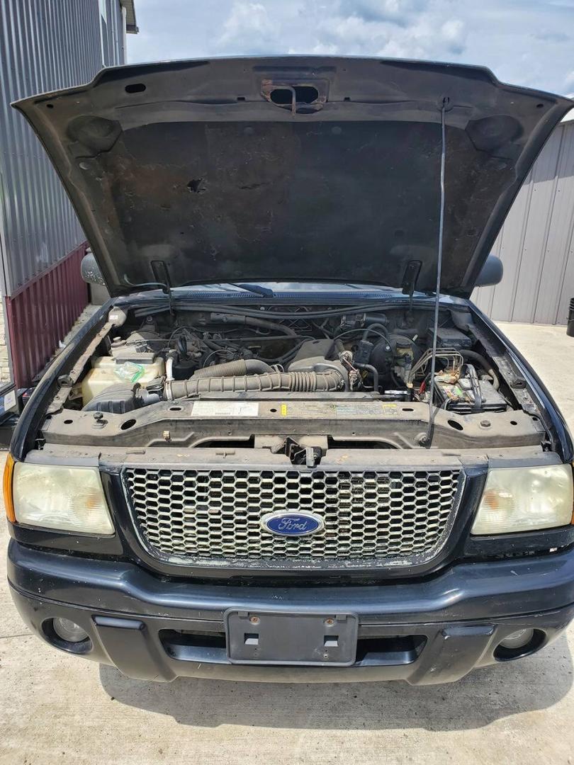2003 Black Ford Ranger (1FTYR10UX3T) with an 3.0L Flex Fuel V6 154hp 180ft. lbs. 3.0L V6 engine, located at 4845 Woodbury Pike, Roaring Springs, PA, (814) 317-5008, (814) 317-5008, 40.250935, -78.366959 - 2003 Ford Ranger Edge 3.0L V6 Automatic 226K miles RWD Aftermarket Kenwood single CD player. Clean Title, being sold As Is. Southern truck that runs and drives great! No mechanical issues. It was driven over 200 miles home from the auction with no issues. It will need inspected for PA because it is- Photo#4