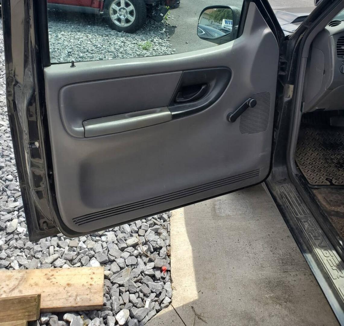 2003 Black Ford Ranger (1FTYR10UX3T) with an 3.0L Flex Fuel V6 154hp 180ft. lbs. 3.0L V6 engine, located at 4845 Woodbury Pike, Roaring Springs, PA, (814) 317-5008, (814) 317-5008, 40.250935, -78.366959 - 2003 Ford Ranger Edge 3.0L V6 Automatic 226K miles RWD Aftermarket Kenwood single CD player. Clean Title, being sold As Is. Southern truck that runs and drives great! No mechanical issues. It was driven over 200 miles home from the auction with no issues. It will need inspected for PA because it is- Photo#8