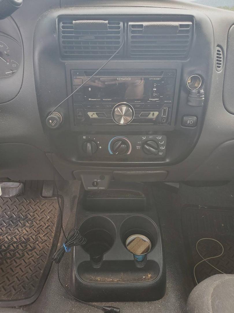 2003 Black Ford Ranger (1FTYR10UX3T) with an 3.0L Flex Fuel V6 154hp 180ft. lbs. 3.0L V6 engine, located at 4845 Woodbury Pike, Roaring Springs, PA, (814) 317-5008, (814) 317-5008, 40.250935, -78.366959 - 2003 Ford Ranger Edge 3.0L V6 Automatic 226K miles RWD Aftermarket Kenwood single CD player. Clean Title, being sold As Is. Southern truck that runs and drives great! No mechanical issues. It was driven over 200 miles home from the auction with no issues. It will need inspected for PA because it is- Photo#9