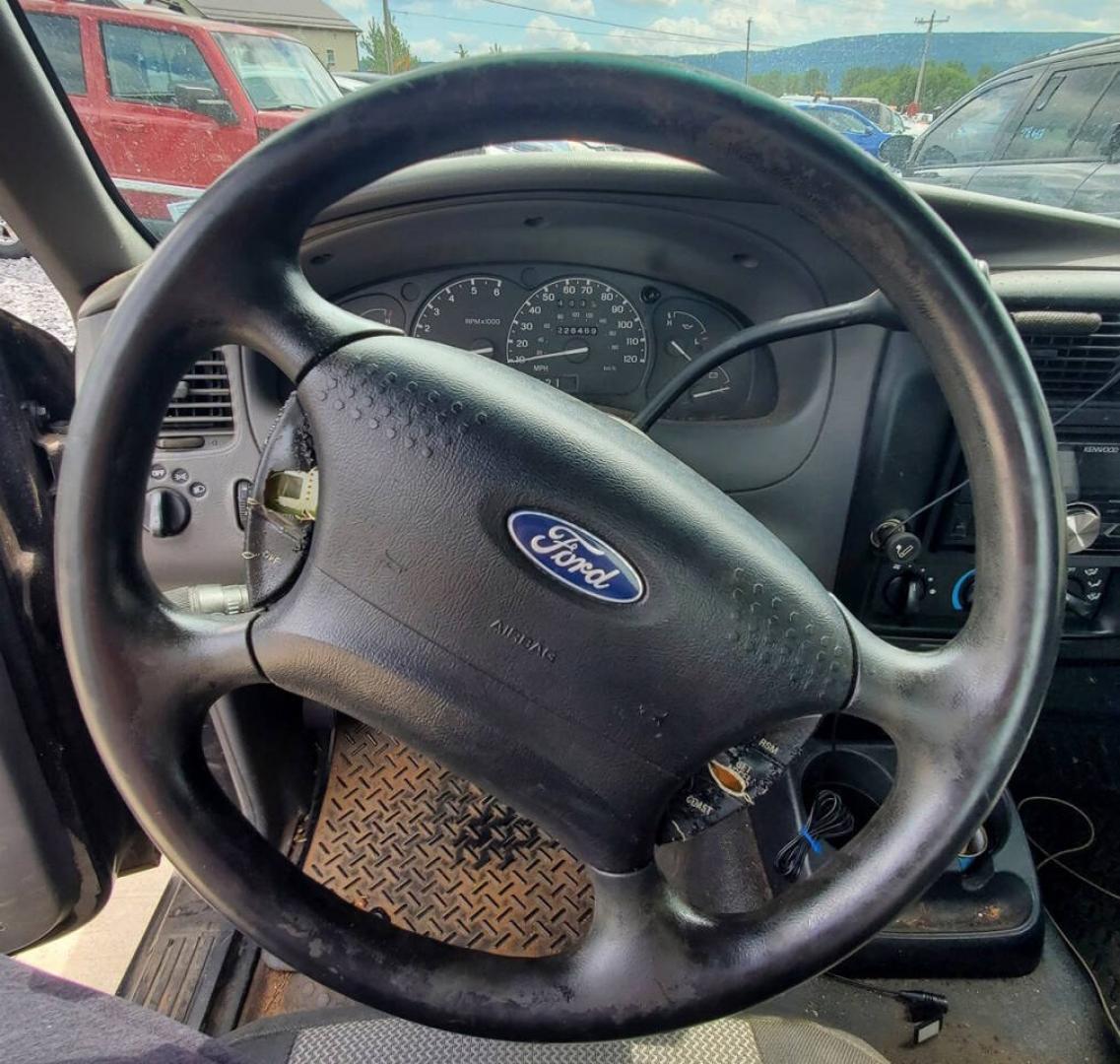 2003 Black Ford Ranger (1FTYR10UX3T) with an 3.0L Flex Fuel V6 154hp 180ft. lbs. 3.0L V6 engine, located at 4845 Woodbury Pike, Roaring Springs, PA, (814) 317-5008, (814) 317-5008, 40.250935, -78.366959 - 2003 Ford Ranger Edge 3.0L V6 Automatic 226K miles RWD Aftermarket Kenwood single CD player. Clean Title, being sold As Is. Southern truck that runs and drives great! No mechanical issues. It was driven over 200 miles home from the auction with no issues. It will need inspected for PA because it is- Photo#10
