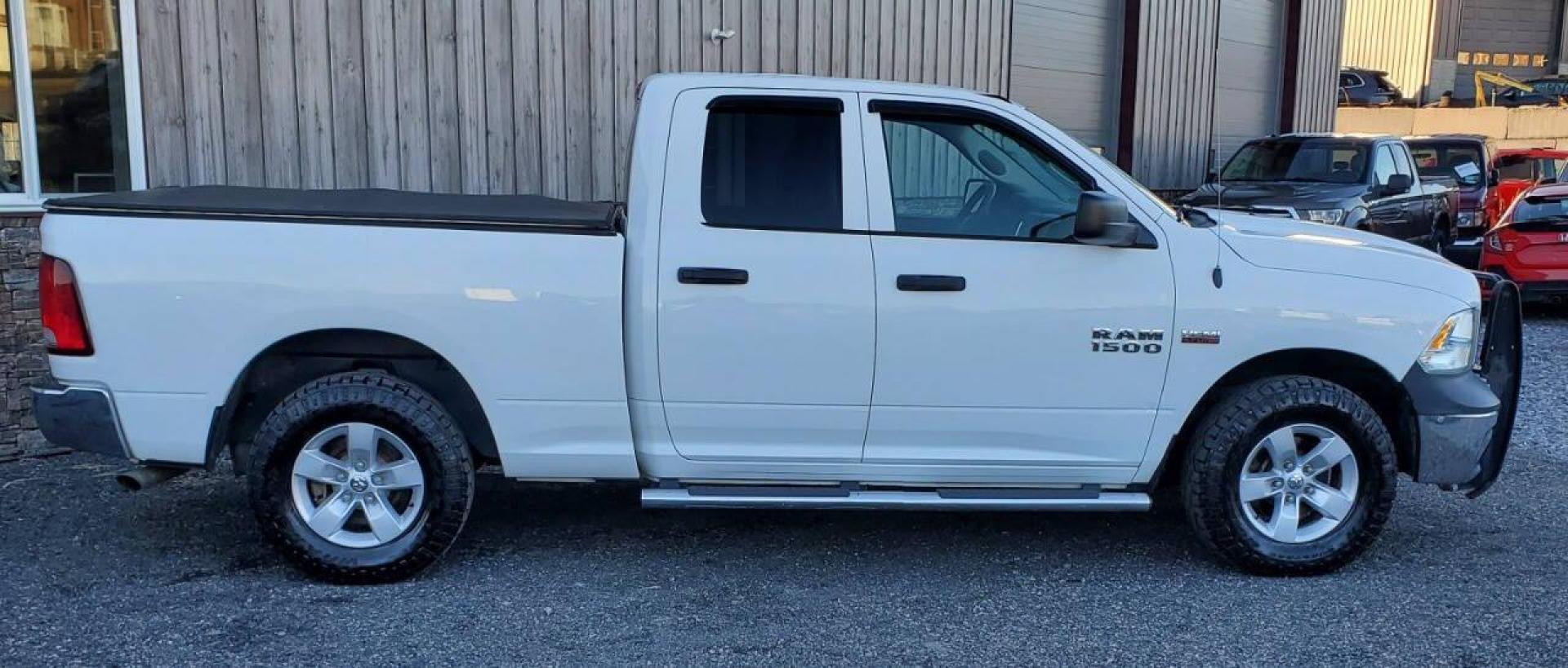2015 White RAM 1500 (1C6RR7FTXFS) with an 5.7L V8 5.7L V8 engine, located at 4845 Woodbury Pike, Roaring Springs, PA, (814) 317-5008, (814) 317-5008, 40.250935, -78.366959 - 2015 RAM 1500 Tradesman Hemi Quad Cab 4x4 5.7L V8 Automatic 262k Miles This truck has a brand-new crate engine motor that comes with a 2 yr/100,000-mile warranty. A/c, Power Windows and Locks, Cruise Control, Bed Cover. Very clean Southern truck! New Inspection. Truck itself will come with a 3-month - Photo#1