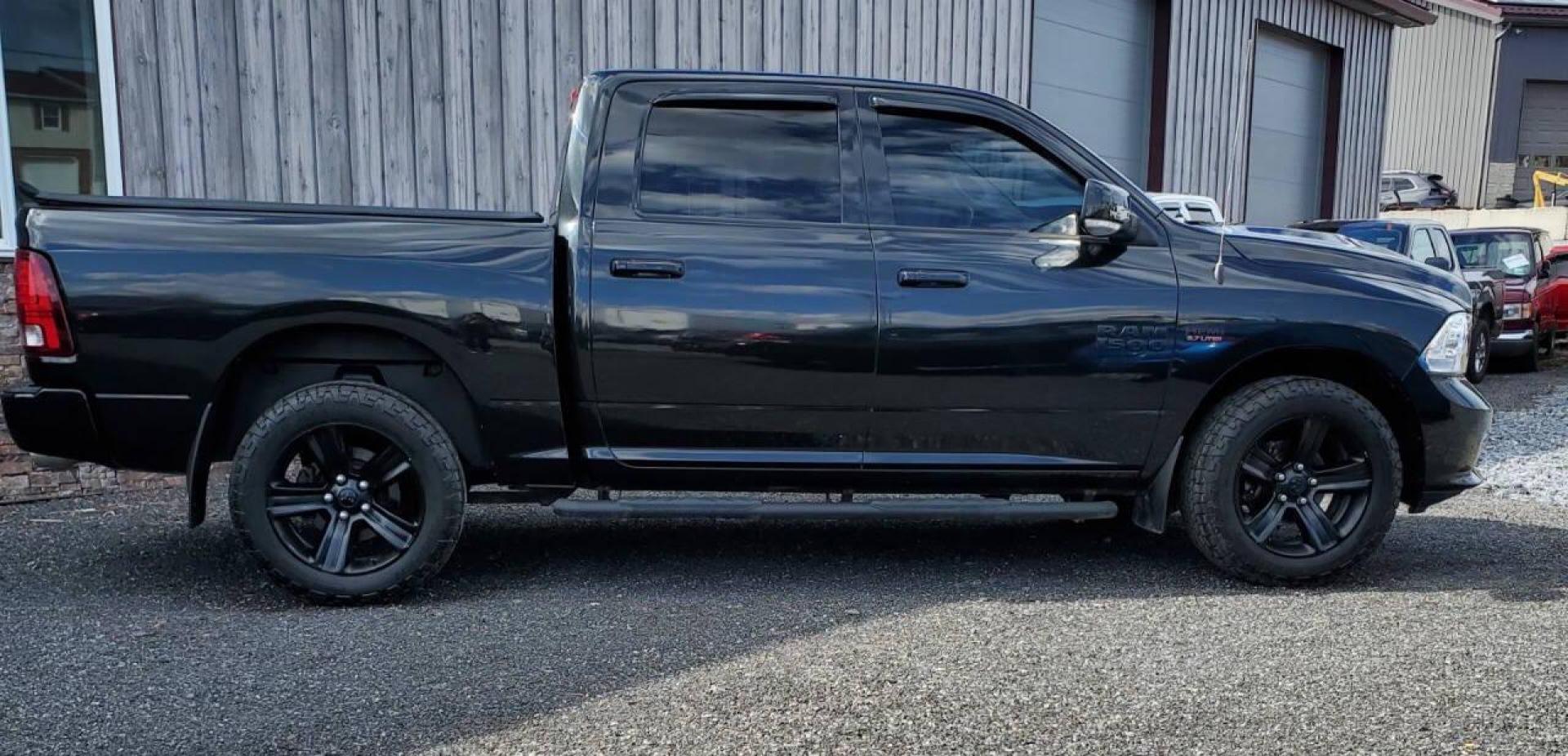 2016 Black RAM 1500 (1C6RR7MTXGS) with an HEMI 5.7L V8 395hp 410ft. lbs. 5.7L V8 engine, located at 4845 Woodbury Pike, Roaring Springs, PA, (814) 317-5008, (814) 317-5008, 40.250935, -78.366959 - Photo#1