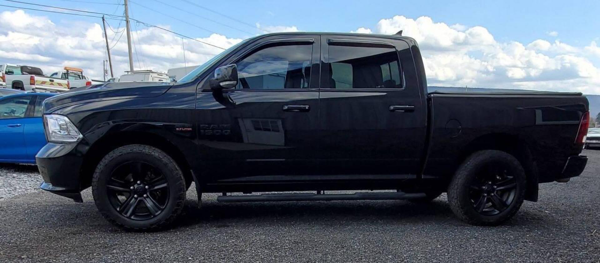 2016 Black RAM 1500 (1C6RR7MTXGS) with an HEMI 5.7L V8 395hp 410ft. lbs. 5.7L V8 engine, located at 4845 Woodbury Pike, Roaring Springs, PA, (814) 317-5008, (814) 317-5008, 40.250935, -78.366959 - Photo#4