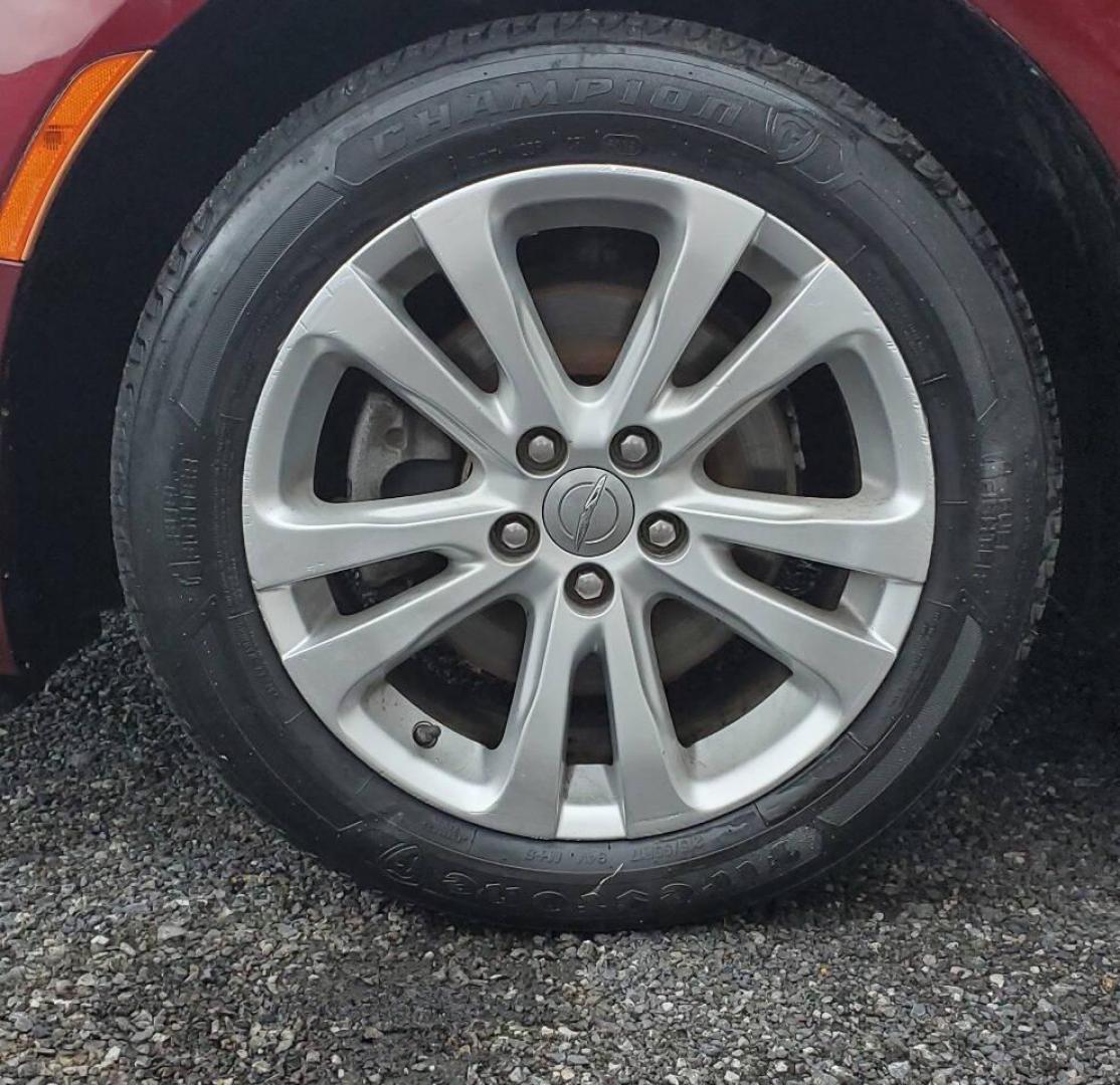 2016 Burgundy Chrysler 200 (1C3CCCAB1GN) with an 2.4L I4 184hp 173ft. lbs. 2.4L I4 engine, located at 4845 Woodbury Pike, Roaring Springs, PA, (814) 317-5008, (814) 317-5008, 40.250935, -78.366959 - 2016 Chrysler 200 Limited FWD 2.4L I4 9-speed Automatic 115k Miles Sirius XM, Bluetooth, Rear Back-up Camera, A/c, Power Windows and Locks, Cruise Control Selling cheaply because it has an R-title due to previous fender damage. That has been repaired. Vehicle will come with new inspection and a 3-mo - Photo#5