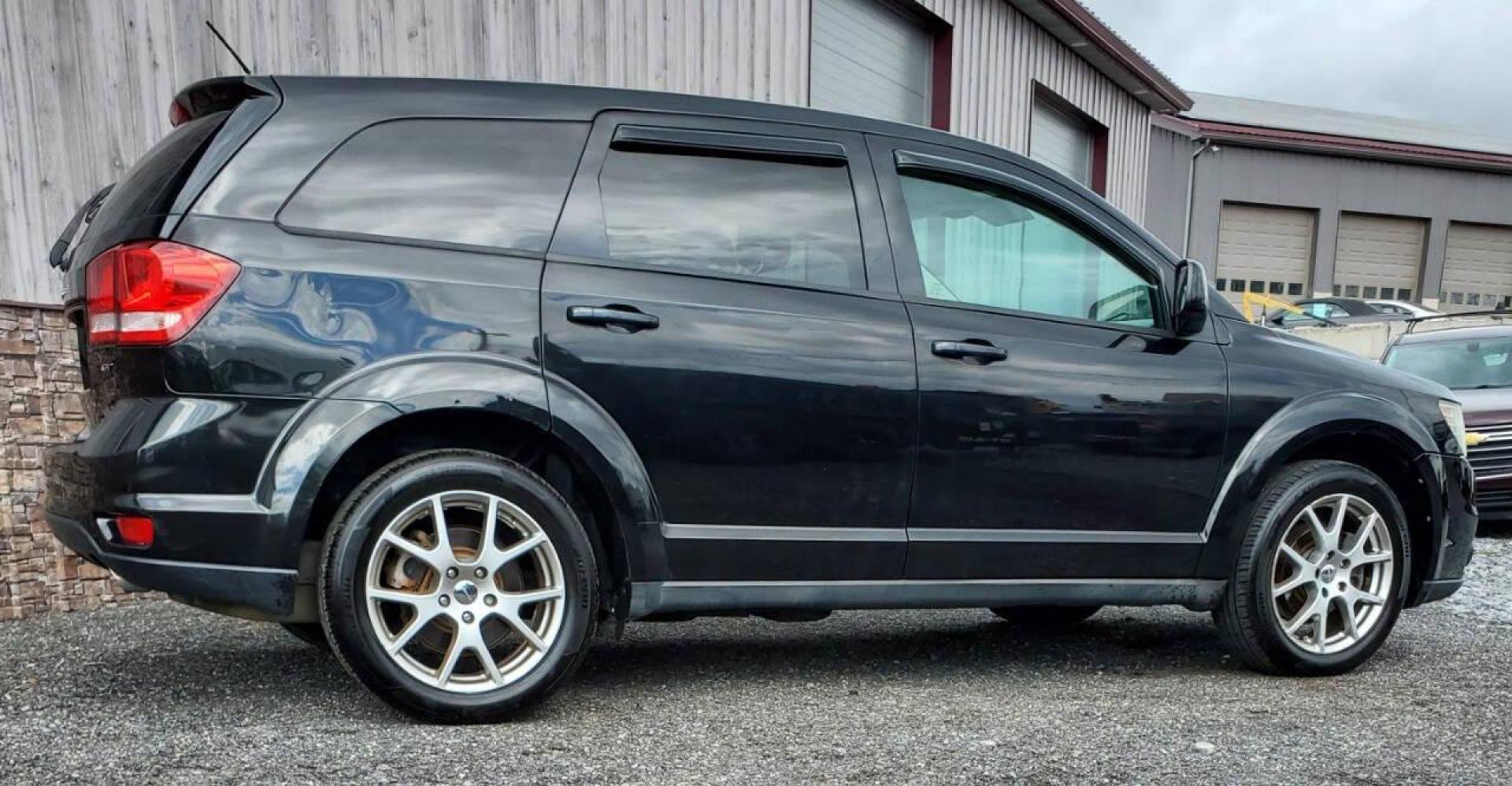 2013 Black Dodge Journey (3C4PDDEG9DT) with an Pentastar 3.6L V6 283hp 260ft. lbs. 3.6L V6 engine, located at 4845 Woodbury Pike, Roaring Springs, PA, (814) 317-5008, (814) 317-5008, 40.250935, -78.366959 - 2013 Dodge Journey R/T AWD 3.6L V6 6-speed Automatic 156k Miles 3rd Row Seating, Heated Front Seats, Heated Steering Wheel, Heated Mirror, Leather, Alpine Sound System, CD Player, Bluetooth, Sirius XM, A/c, Cruise Control, Keyless Entry, Power Windows/Locks. If you have any questions or would like t - Photo#1