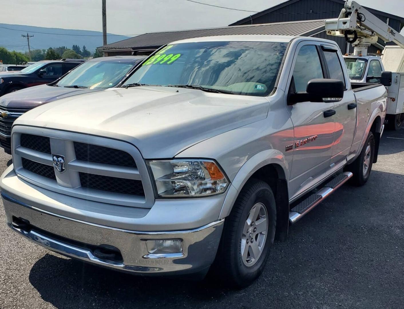 2012 Bright Silver Metallic Clear Coat/Mineral Gray Met RAM 1500 (1C6RD7GT2CS) with an HEMI 5.7L V8 390hp 407ft. lbs. 5.7L V8 engine, located at 4845 Woodbury Pike, Roaring Springs, PA, (814) 317-5008, (814) 317-5008, 40.250935, -78.366959 - **More pics and video to come. Truck will be fully detailed before sale<br />2012 Ram 1500 4x4 Outdoorsman 4 Door Quad Cab 6.3' Short Bed 5.7L V8 Hemi 6-Speed Automatic 105k Miles Rust-Free Southern Truck with a Clean Title A/C, Cruise Control, Alpine Sound System, Sirius XM, Single CD Player, Keyle- Photo#0